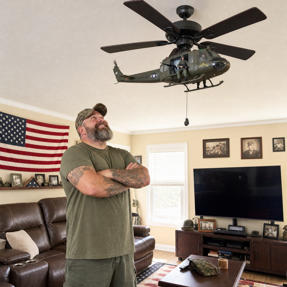 Man standing under a helicopter fan attachment in his living room